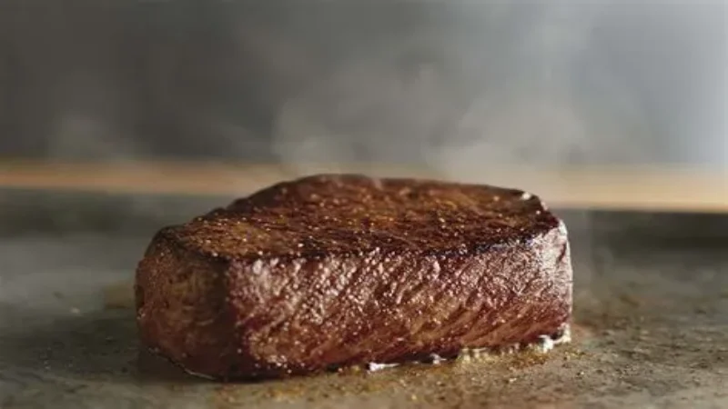 Tender cut Flo's Filet mignon steak served on a white plate